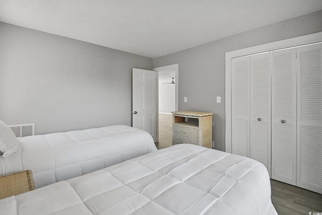 bedroom featuring a closet and wood finished floors