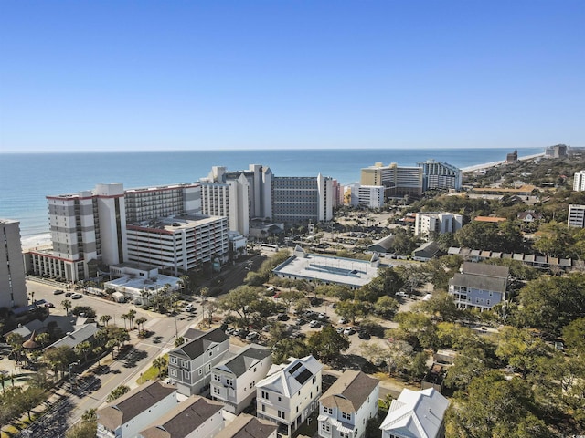 birds eye view of property featuring a view of city and a water view