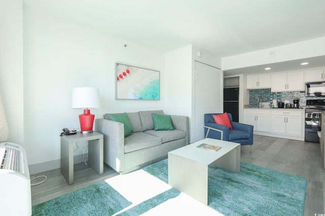 2401 S Ocean Blvd Unit 971, Myrtle Beach, SC 29577 - living area featuring light wood finished floors and baseboards