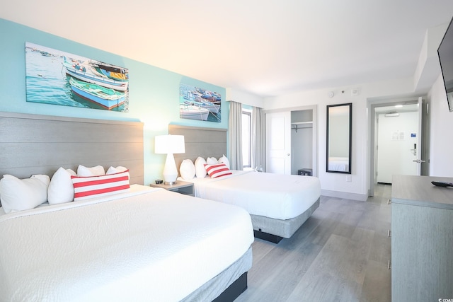 2401 S Ocean Blvd Unit 971, Myrtle Beach, SC 29577 - bedroom featuring baseboards, a closet, and light wood-style flooring