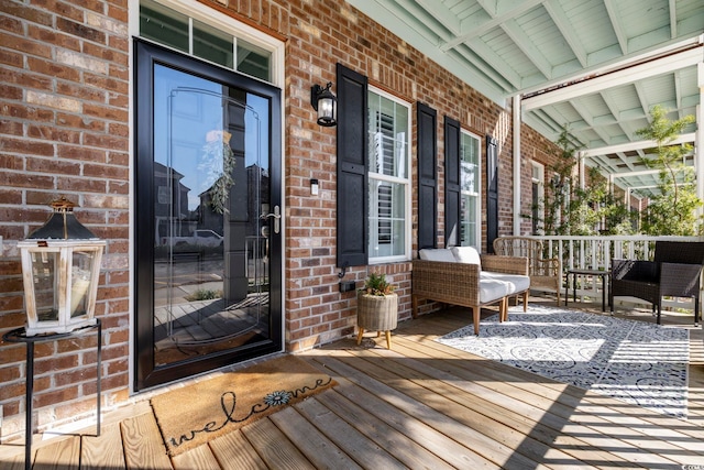 wooden deck featuring covered porch