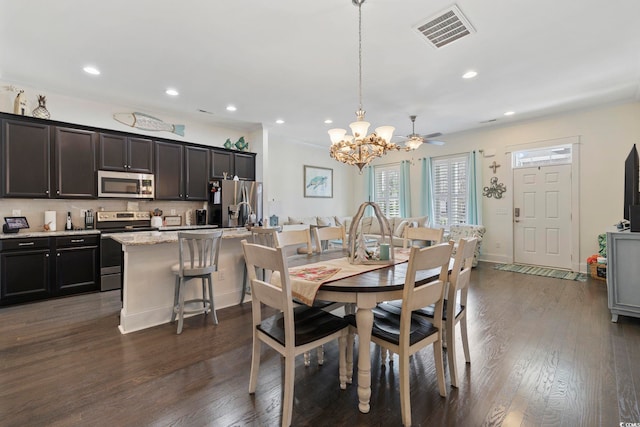 dining space featuring dark wood finished floors, recessed lighting, visible vents, a chandelier, and baseboards