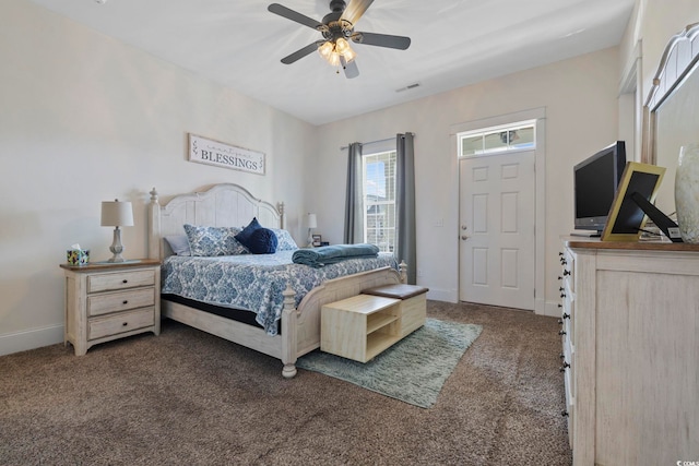 carpeted bedroom featuring visible vents and baseboards