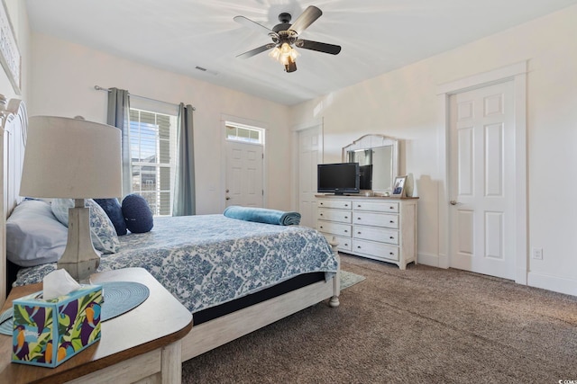 bedroom with carpet, visible vents, ceiling fan, and baseboards