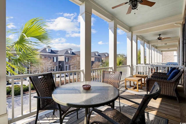 exterior space featuring ceiling fan, a residential view, and outdoor dining space