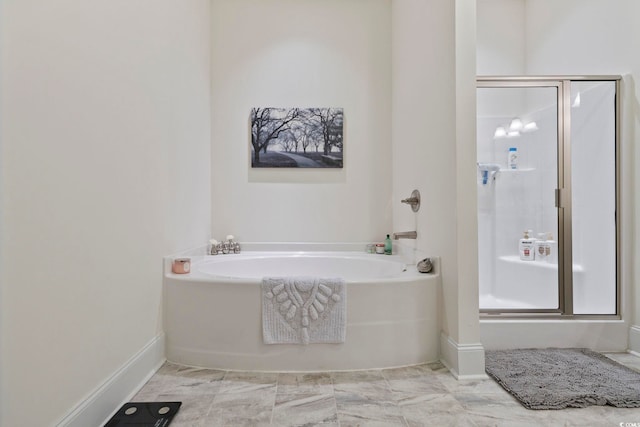 full bath featuring a shower stall and a bath