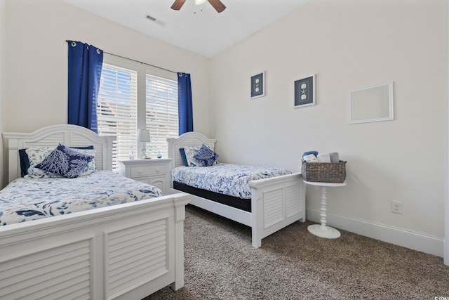 carpeted bedroom with visible vents, ceiling fan, and baseboards