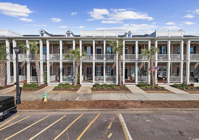 view of building exterior featuring uncovered parking