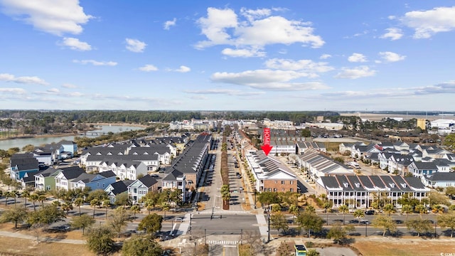 bird's eye view featuring a water view and a residential view