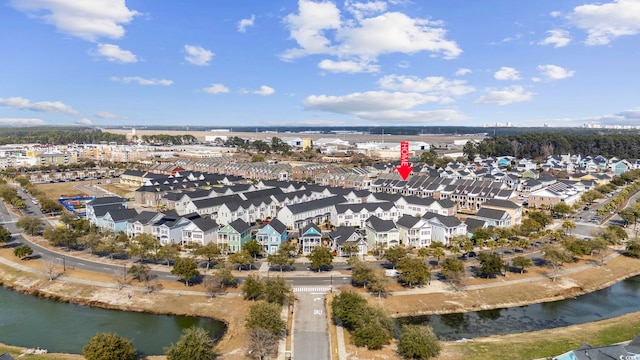 birds eye view of property with a water view and a residential view