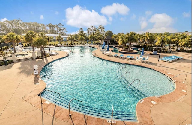 pool with a patio