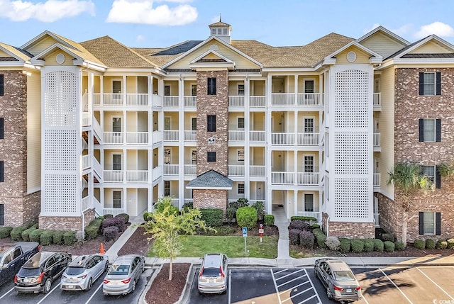 view of property with uncovered parking