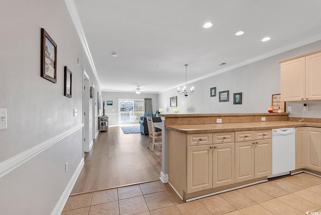 kitchen with ornamental molding, open floor plan, light tile patterned flooring, dishwasher, and a peninsula