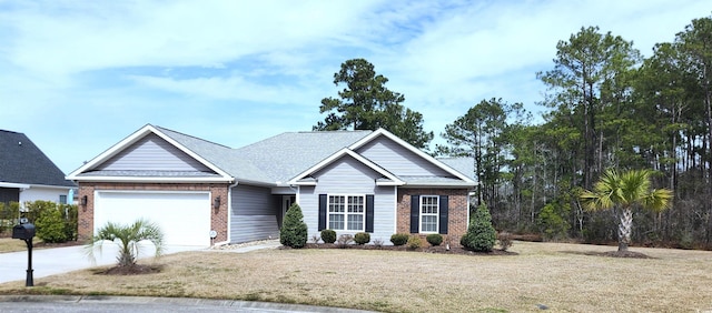 view of front of home with brick siding, an attached garage, and a front yard