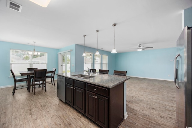 kitchen with plenty of natural light, visible vents, stainless steel appliances, light wood-type flooring, and a sink