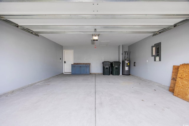 garage with a garage door opener, electric panel, and water heater