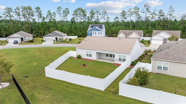 drone / aerial view featuring a wooded view