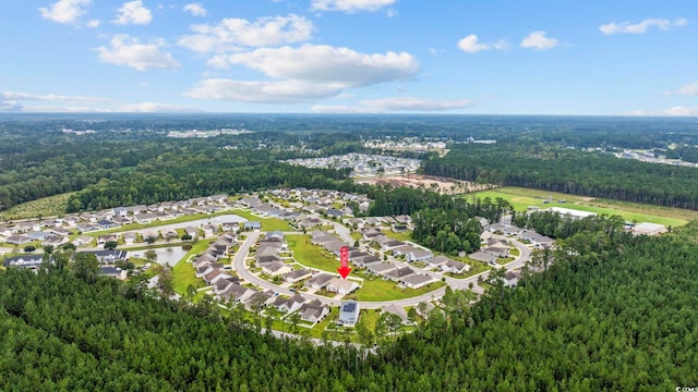 birds eye view of property with a residential view and a view of trees