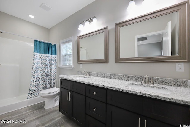 full bathroom featuring double vanity, a sink, visible vents, and a shower with curtain