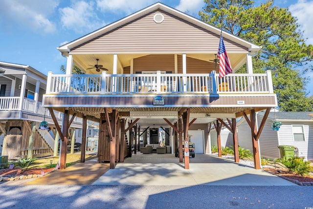 view of front of property featuring a carport and ceiling fan