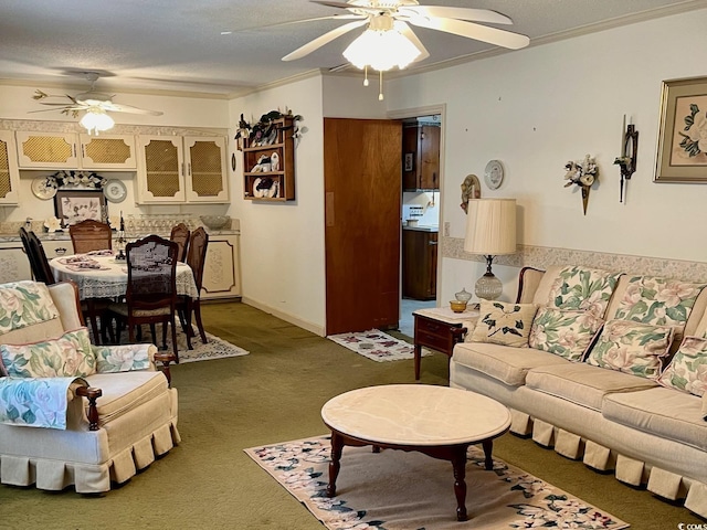 carpeted living room with ceiling fan, ornamental molding, and a textured ceiling