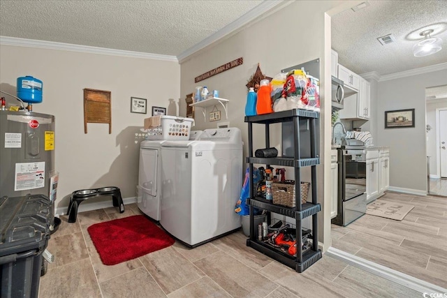 washroom featuring laundry area, crown molding, a textured ceiling, washing machine and dryer, and water heater