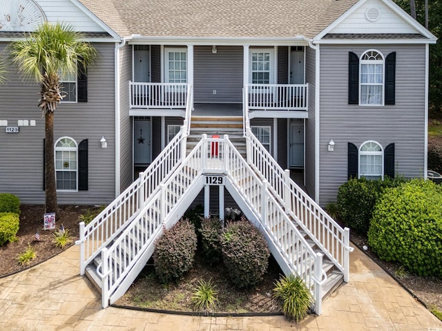 view of property featuring stairs