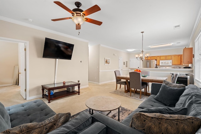 living room with baseboards, visible vents, ornamental molding, and light colored carpet