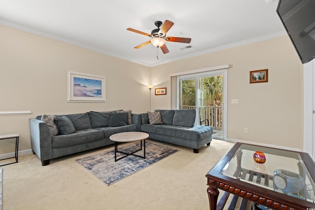 carpeted living area featuring visible vents, crown molding, baseboards, and ceiling fan