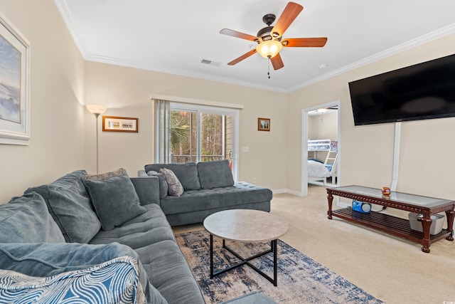 carpeted living room featuring ceiling fan, ornamental molding, visible vents, and baseboards