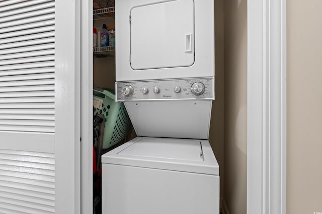 washroom with laundry area and stacked washer and clothes dryer