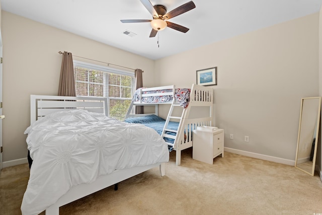 bedroom featuring carpet flooring, ceiling fan, visible vents, and baseboards