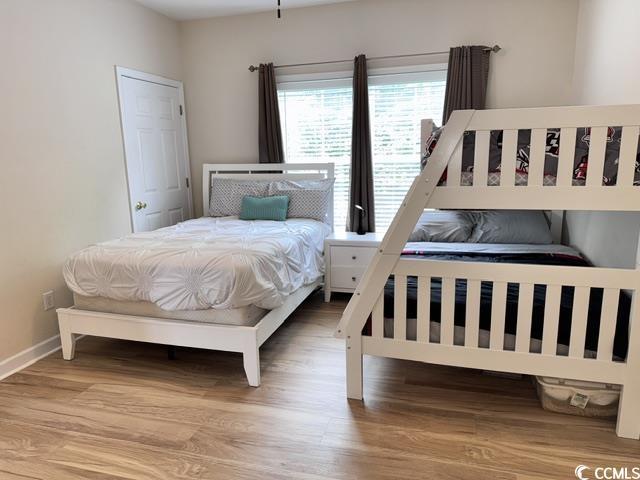 6253 Catalina Dr Unit 921, North Myrtle Beach, SC 29582 - bedroom with wood finished floors and baseboards