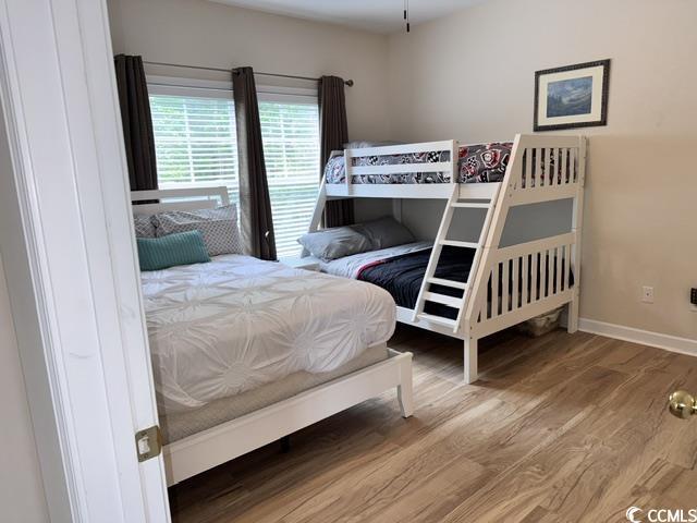 6253 Catalina Dr Unit 921, North Myrtle Beach, SC 29582 - bedroom with wood finished floors and baseboards