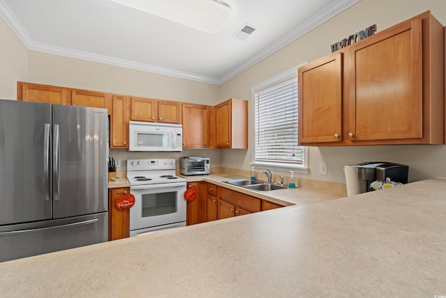 kitchen with light countertops, white appliances, visible vents, and crown molding