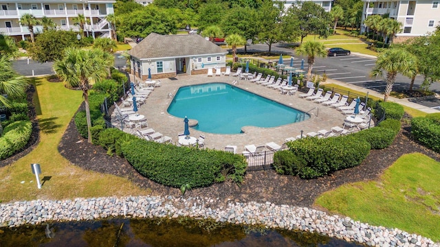 pool featuring a patio and fence