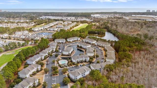 birds eye view of property featuring a water view and a residential view