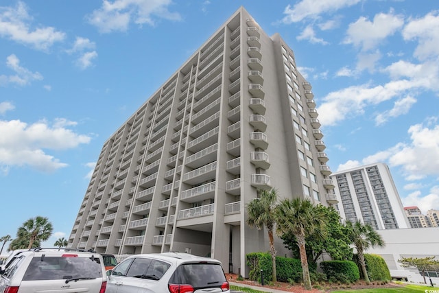 9820 Queensway Blvd Unit 301, Myrtle Beach, SC 29572 - view of building exterior with uncovered parking