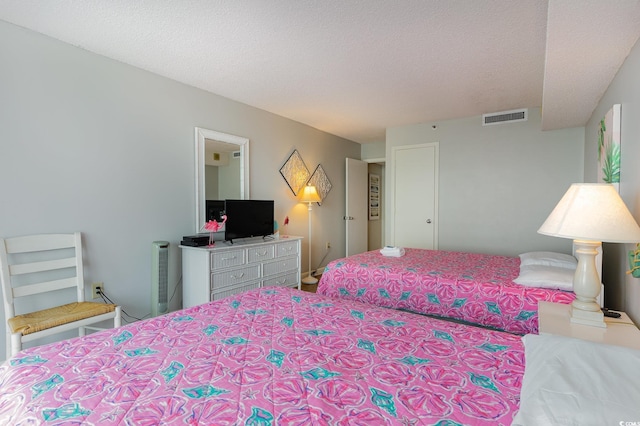 9820 Queensway Blvd Unit 301, Myrtle Beach, SC 29572 - carpeted bedroom featuring a textured ceiling