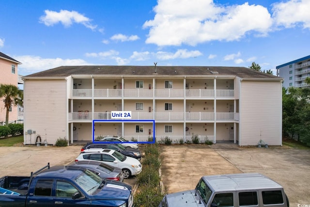 3308 S Ocean Blvd Unit 2-A, North Myrtle Beach, SC 29582 - view of apartment building / complex featuring uncovered parking