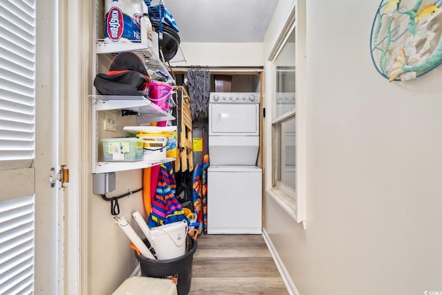 3308 S Ocean Blvd Unit 2-A, North Myrtle Beach, SC 29582 - storage room featuring stacked washer / drying machine