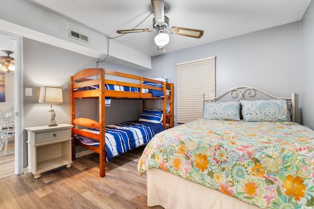 3308 S Ocean Blvd Unit 2-A, North Myrtle Beach, SC 29582 - bedroom featuring wood finished floors and a ceiling fan