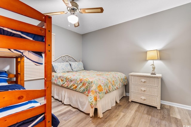 3308 S Ocean Blvd Unit 2-A, North Myrtle Beach, SC 29582 - bedroom featuring wood finished floors, baseboards, and ceiling fan