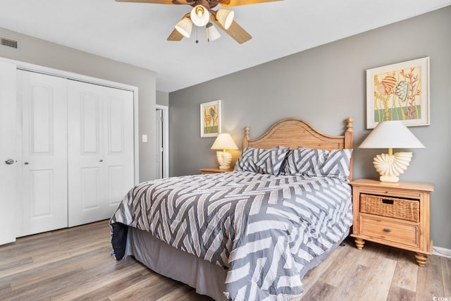 3308 S Ocean Blvd Unit 2-A, North Myrtle Beach, SC 29582 - bedroom featuring a closet, wood finished floors, and a ceiling fan