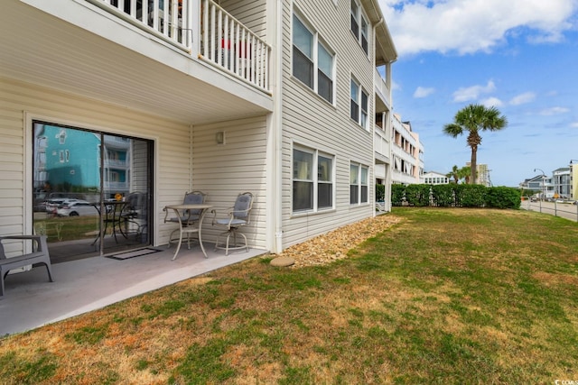 3308 S Ocean Blvd Unit 2-A, North Myrtle Beach, SC 29582 - view of grassy yard with a patio