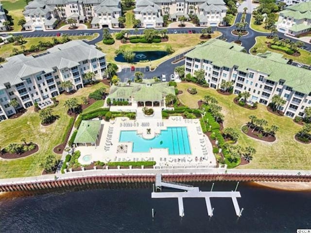 bird's eye view featuring a water view and a residential view