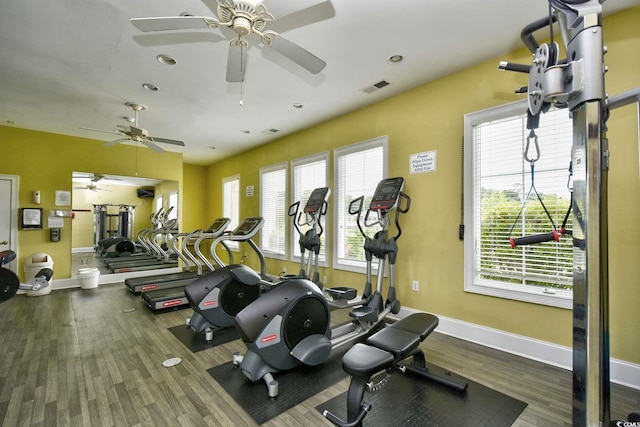 exercise room with recessed lighting, wood finished floors, visible vents, and baseboards