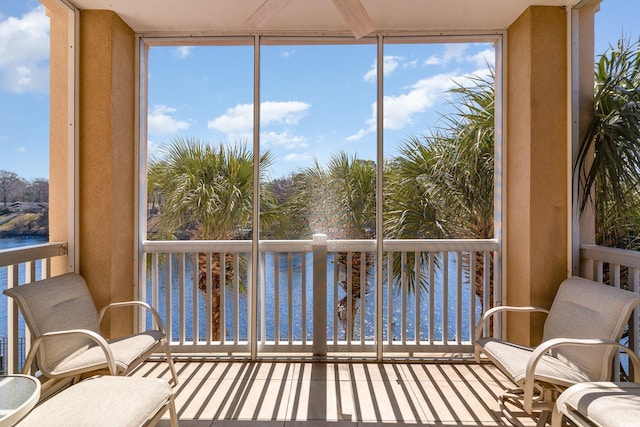 sunroom with a water view