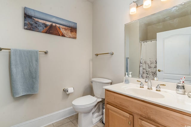 bathroom featuring toilet, a shower with shower curtain, vanity, baseboards, and tile patterned floors