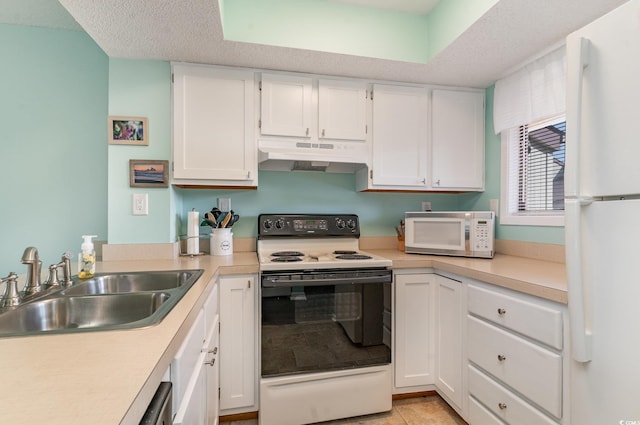 kitchen with light countertops, white cabinets, a sink, white appliances, and under cabinet range hood